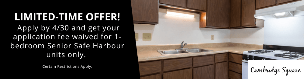 A kitchen interior with a counter and a stove top oven.