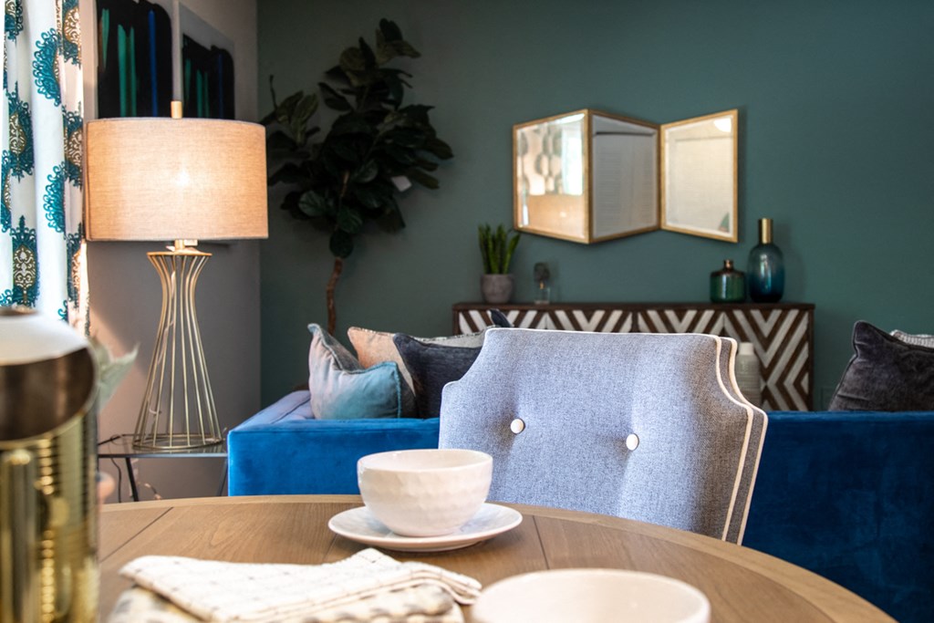 Dining and living space open to each other at Ashton Brook Apartments.