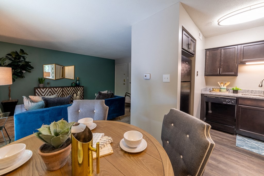 At Ashton Brook Apartments, the dining room is open to the living room and has easy access to the kitchen