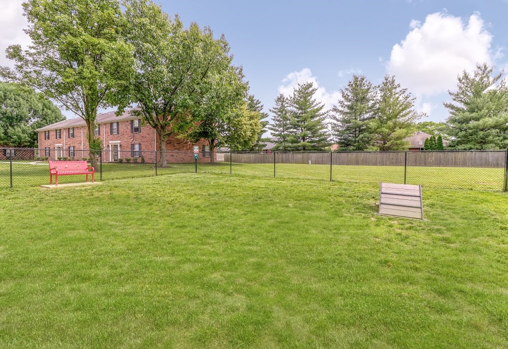 Dog park with bench seating at Ashley Pointe Apartments