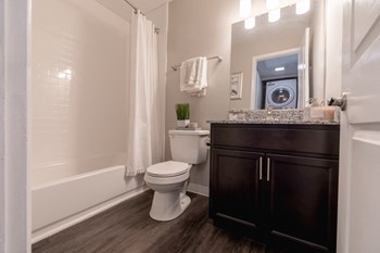 Full Bathroom at Woodbridge Apartments Bloomington - Photo Gallery 25