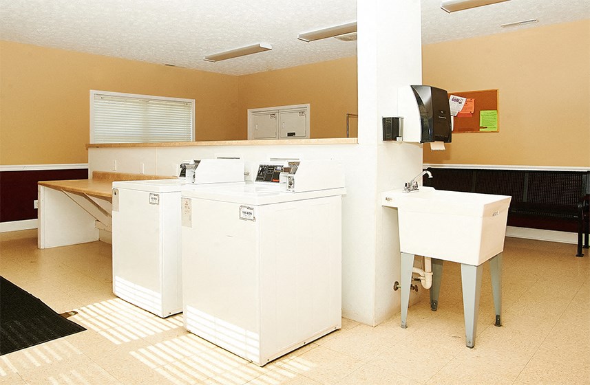 Coin-loaded washers and dryers available in the Resident Laundry Center