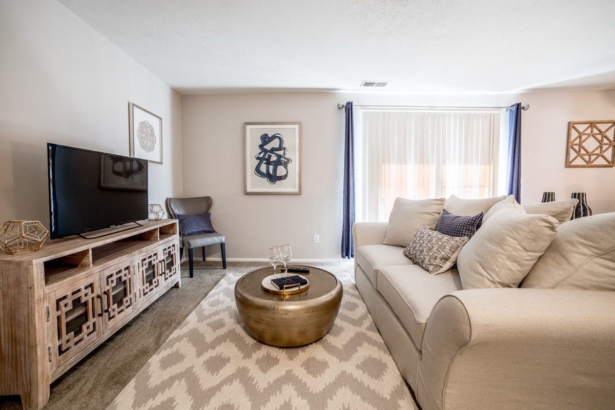 Living Room with a sliding door to the patio/balcony at Chelsea Village Apartments