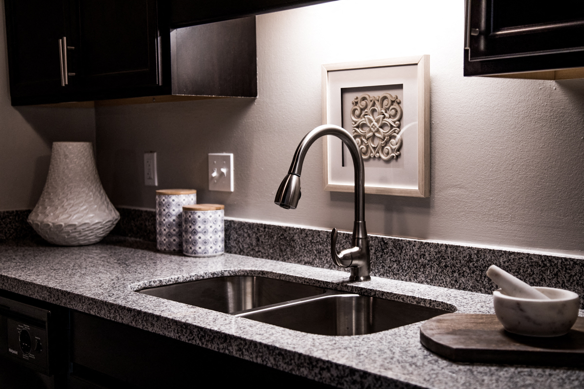 Updated Kitchen With Granite Countertops and Stainless-Steel Sink