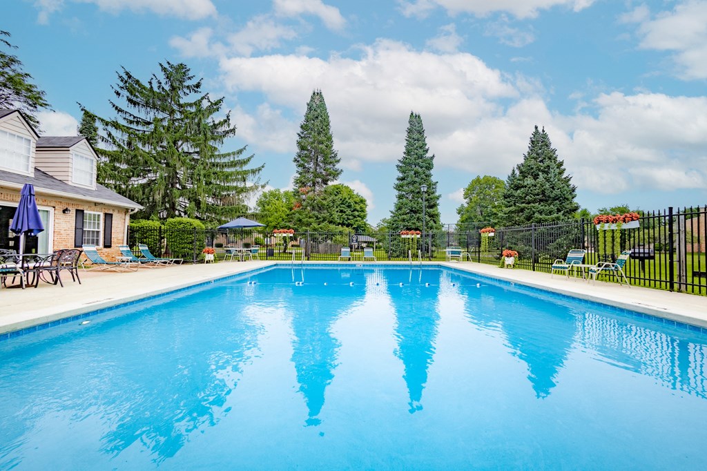 Swimming pool with seating at University Park Apartments