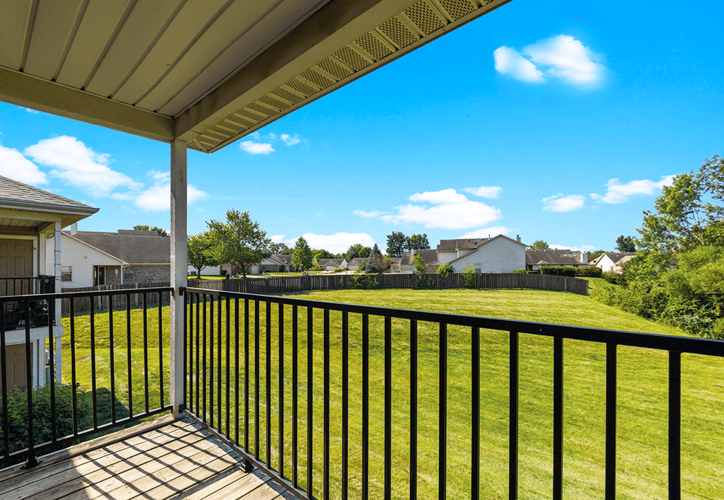 Private balcony at Brownsburg Pointe with space for seating and scenic community views.