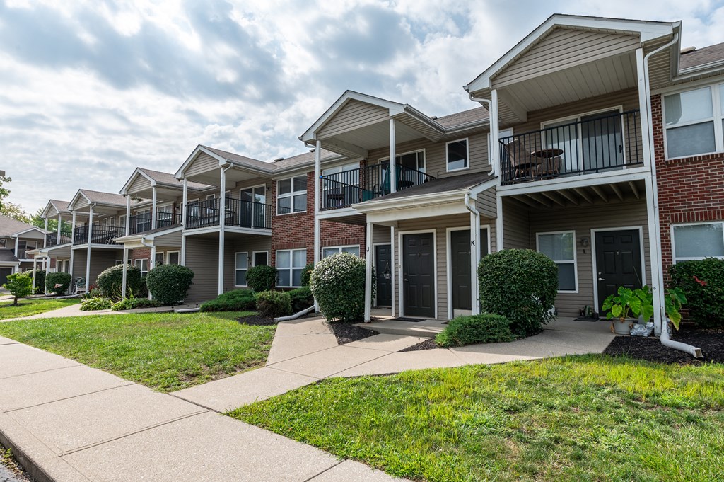 Apartment building exterior with sidewalk at Brownsburg Pointe.