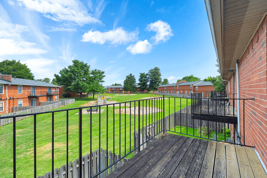 Balcony of a 1-bed, 1-bath apartment in Mount Vernon, featuring a railing and space for outdoor seating with views of the surrounding area.