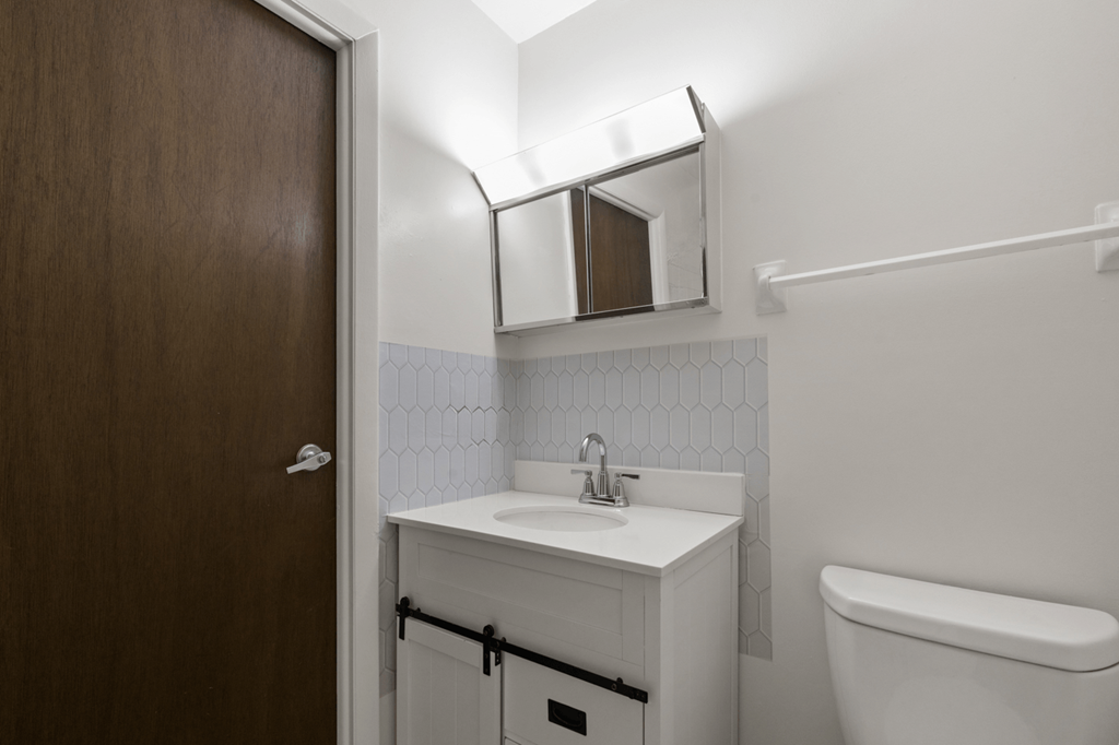 Bathroom with sink and mirror in a 1-bedroom, 1-bath senior apartment at Northwood Apartments in Franklin.