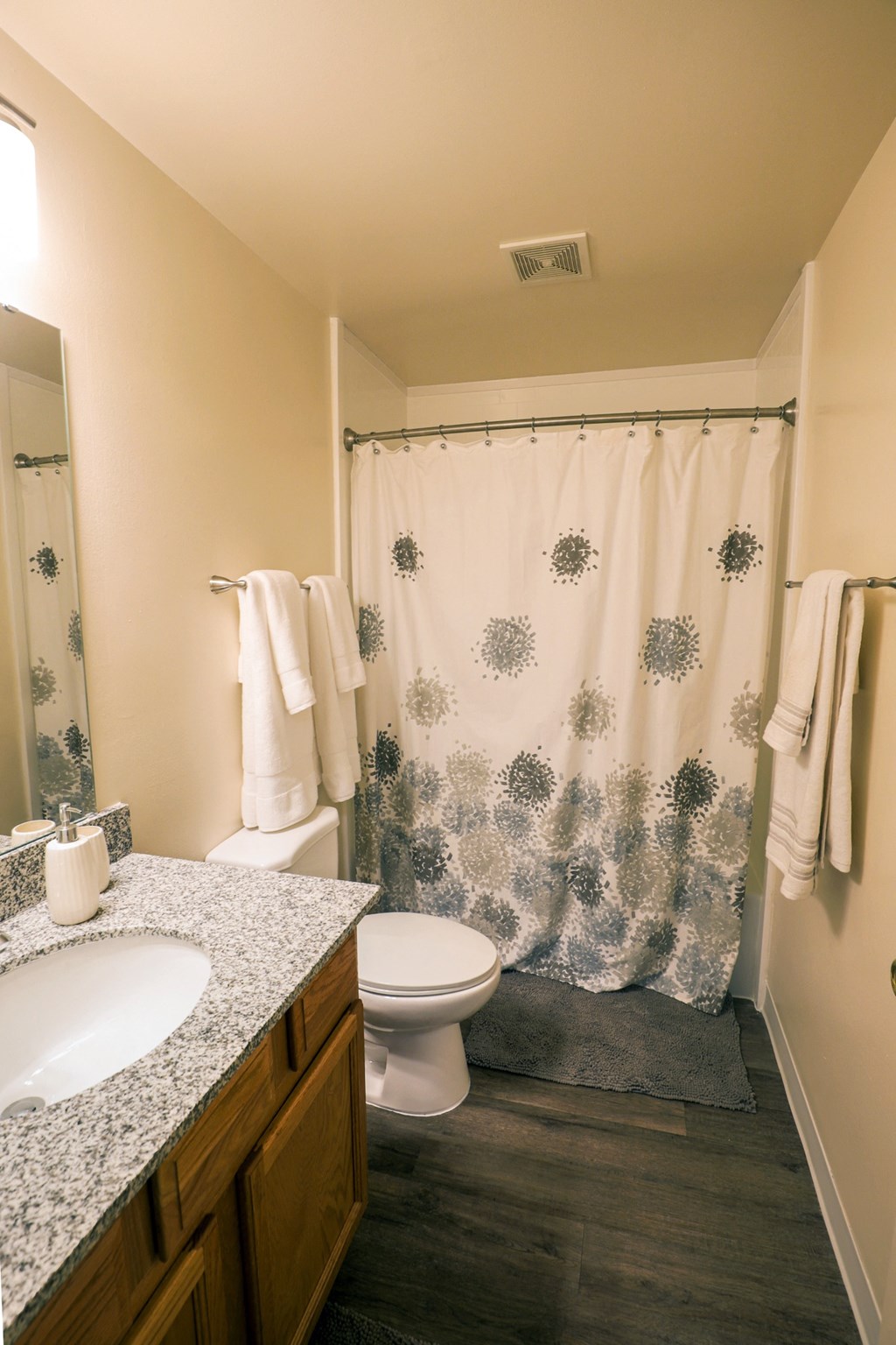 Bathroom with vanity, toilet, and shower at Archer's Pointe.