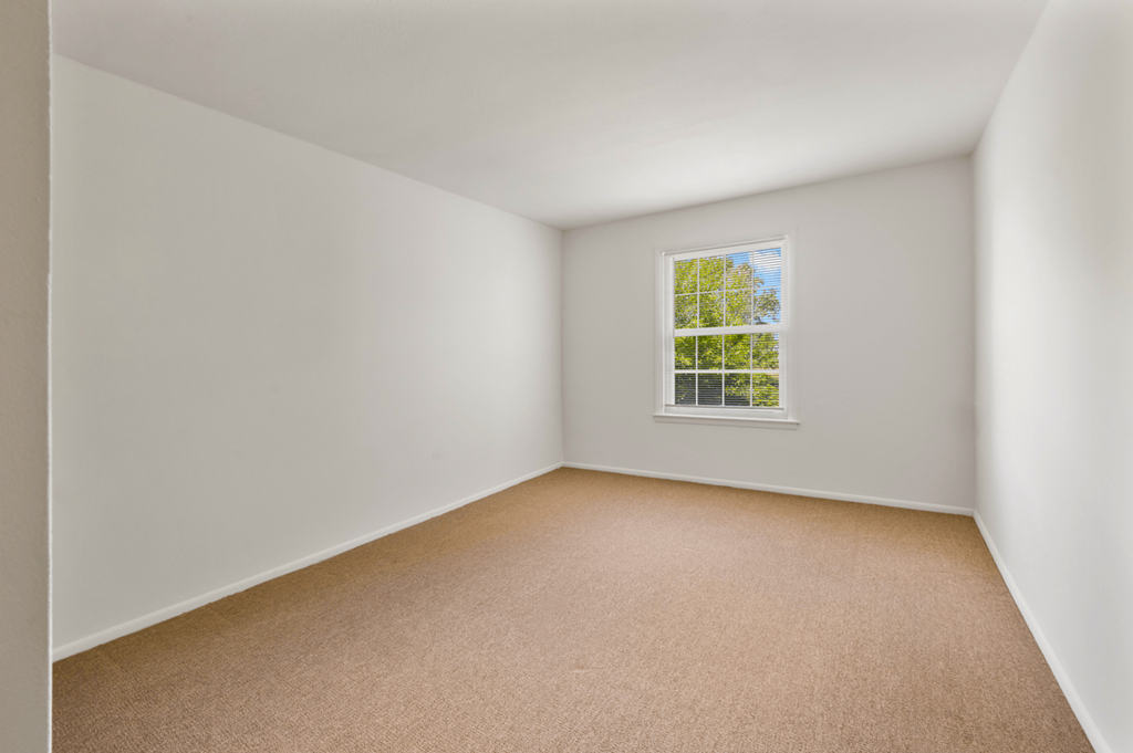 Bedroom in a 1-bedroom, 1-bath senior apartment at Northwood Apartments in Franklin.