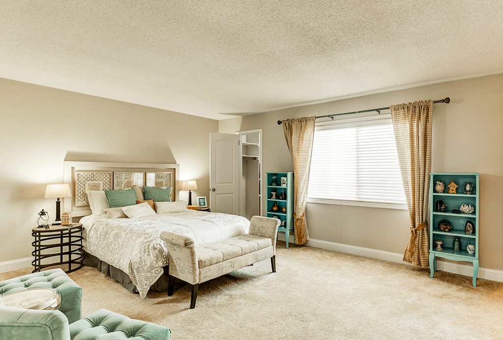 Bedroom in a Signature series 2-bed, 2-bath apartment at Somerset Lakes, featuring a spacious layout and natural light.