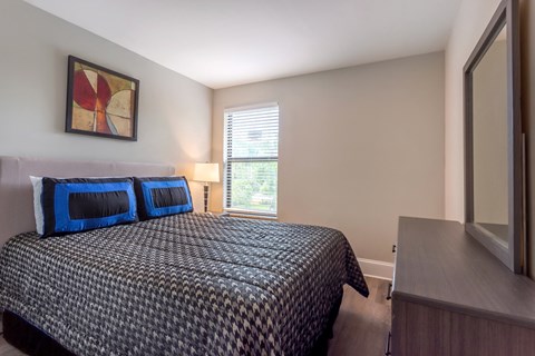 Bedroom with a window at Halcyon Apartments, Hollywood, FL.