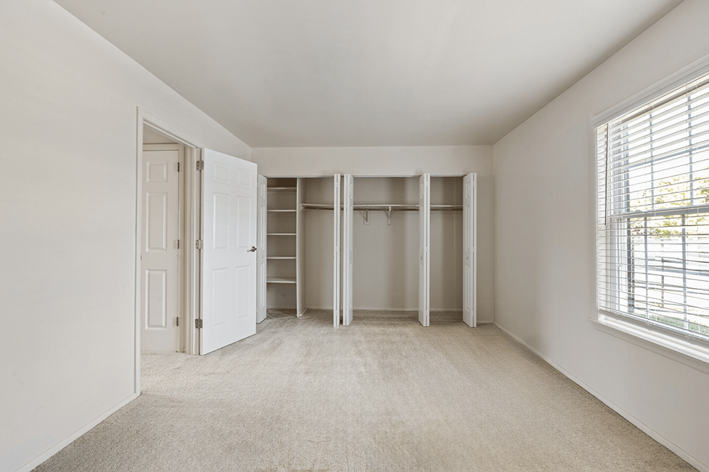 Bedroom with closets in a 1-bed, 1-bath apartment at Carriage House Apartments, Kendallville.