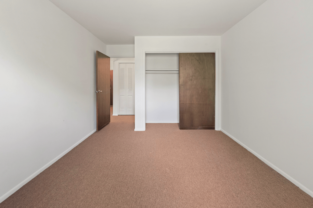 Bedroom with closet in a 1-bedroom, 1-bath senior apartment at Northwood Apartments in Franklin.