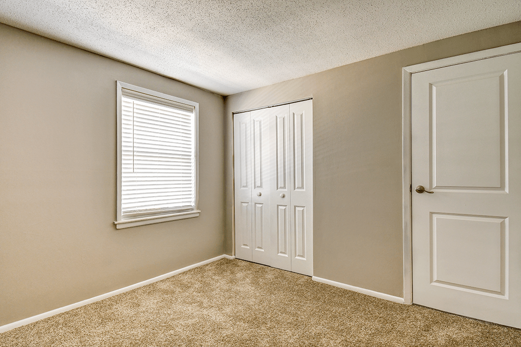 Bedroom with a closet in a 2-bed, 1-bath apartment at Ashton Brook.