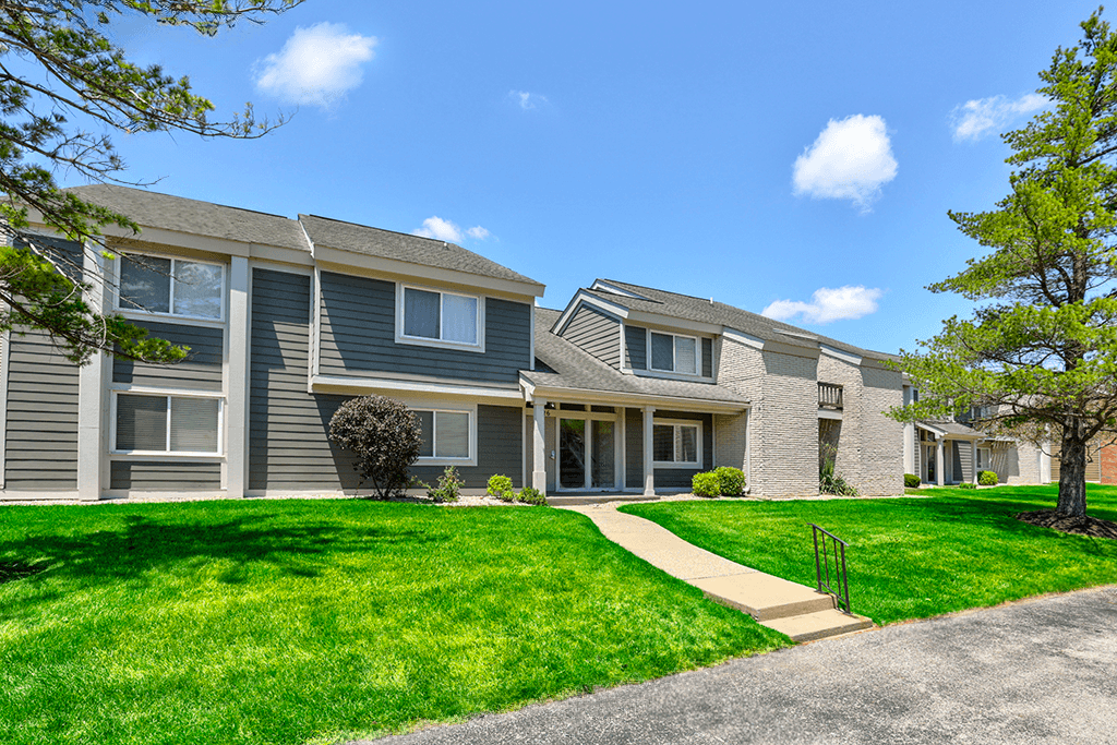 Exterior of a building at Somerset Lakes Apartments, showcasing a well-maintained facade and surrounding landscaping.