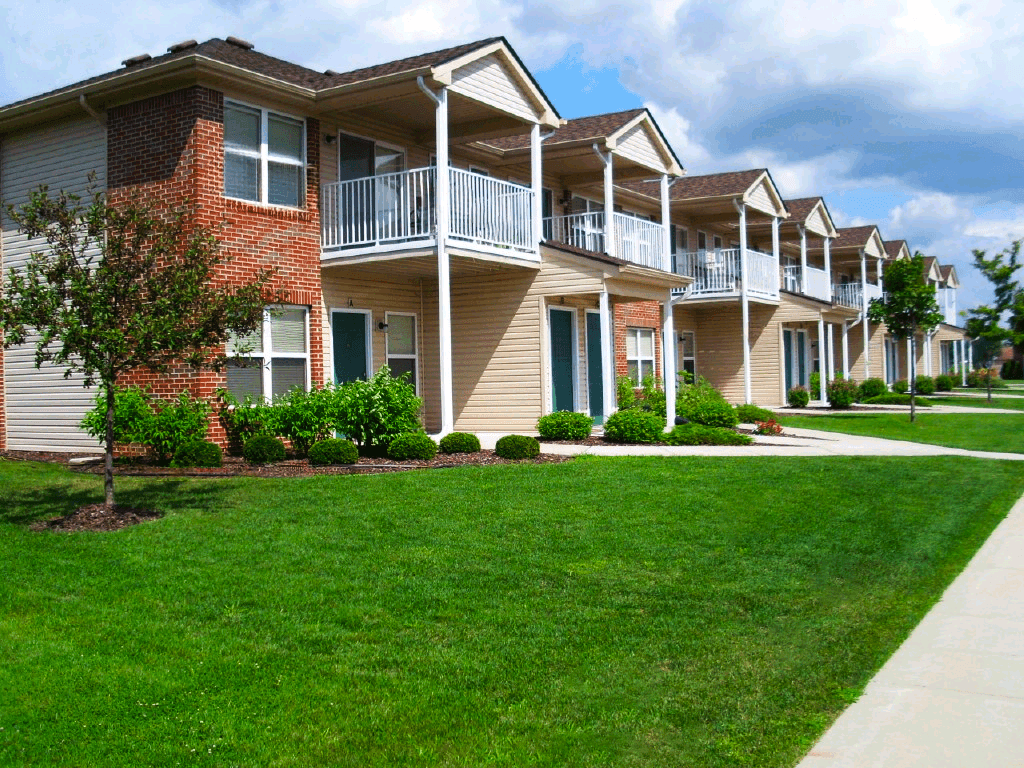 Exterior view of North Lake Apartments showcasing the building's architecture and landscaping.