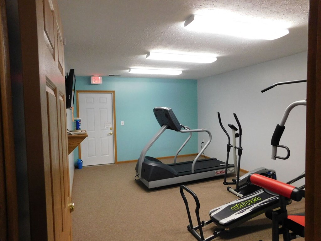 Fitness center with cardio equipment at Chapelgate Park Apartments