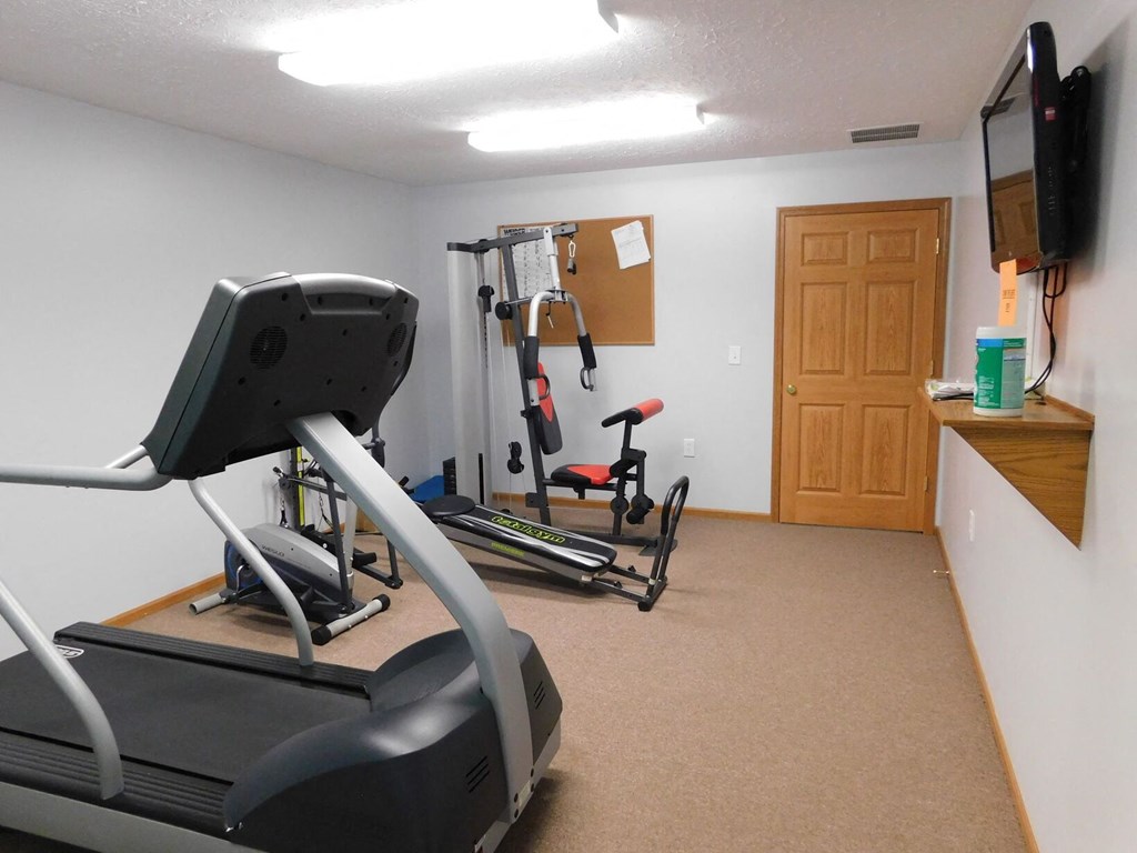 Fitness center with cardio equipment at Chapelgate Park Apartments
