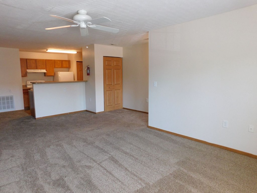 Unfurnished living room with a ceiling fan at Chapelgate Park Apartments