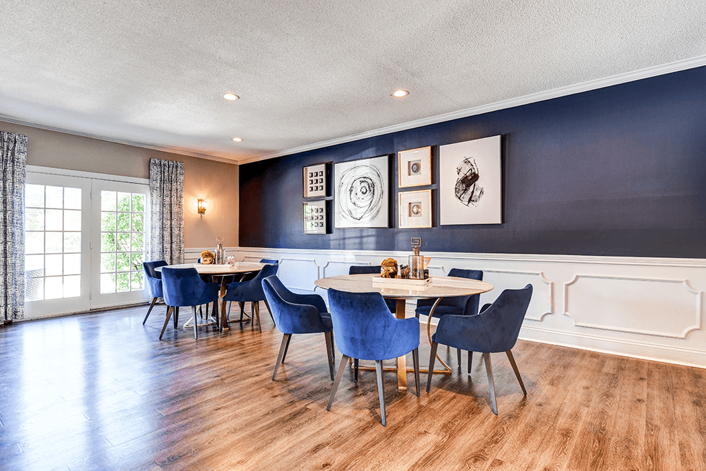 Clubhouse dining area at Ashton Brook Apartments, featuring a tables and seating.