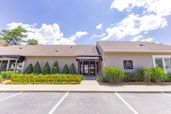 Leasing Center Exterior Club House Amenities at Woodbridge of Castleton Exterior of the clubhouse and leasing center at Woodbridge Apartments - Photo Gallery 2