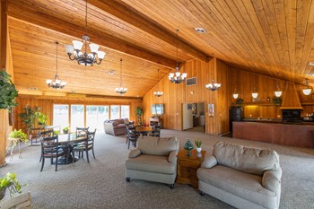 Clubhouse at Woodbridge of Castleton Clubhouse with a full kitchen and an entertainment area with ample seating at Woodbridge Apartments - Photo Gallery 4