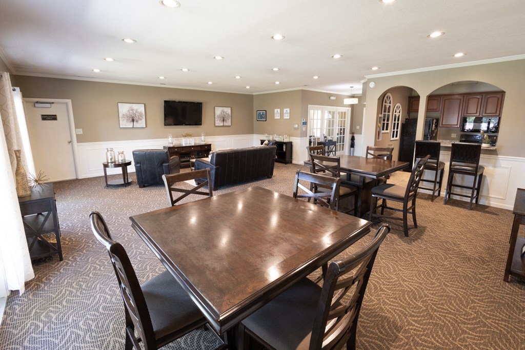Clubhouse interior with entertainment area and a kitchen at Archer's Pointe.