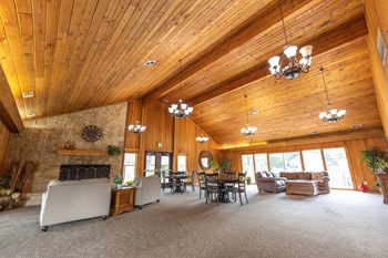 Clubhouse at Woodbridge of Castleton Clubhouse Interior with ample seating seating at Woodbridge Apartments - Photo Gallery 3