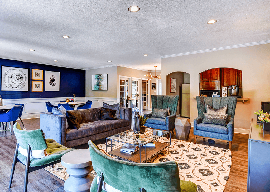 Clubhouse lounge at Ashton Brook Apartments, featuring comfortable seating and a welcoming space for residents to relax.
