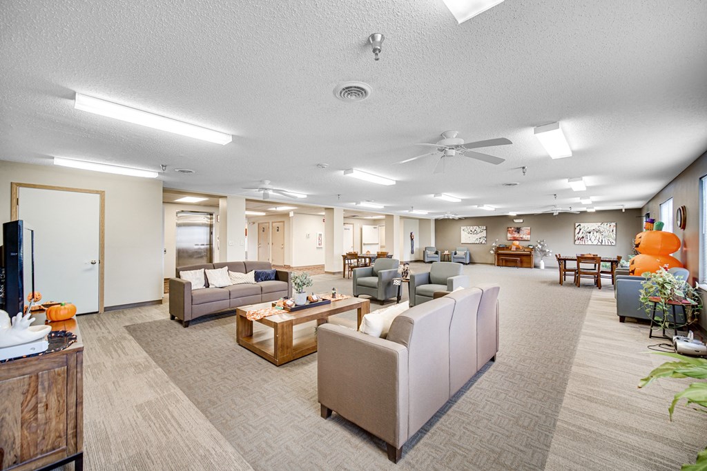 Community room with ample seating at Kirby Manor