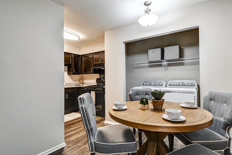 Dining room with in-unit laundry in a 1-bed, 1-bath apartment at Ashton Brook, featuring a functional space.