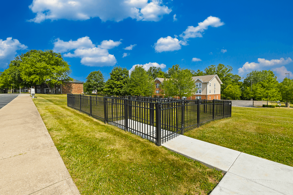 Dog park at Country View Apartments, featuring fenced grass areas for pets to enjoy and socialize.