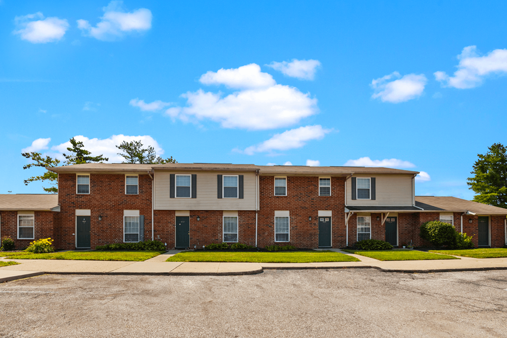 Exterior view of Windsor Park Apartments, showcasing landscaped grounds, and well-maintained entryways.