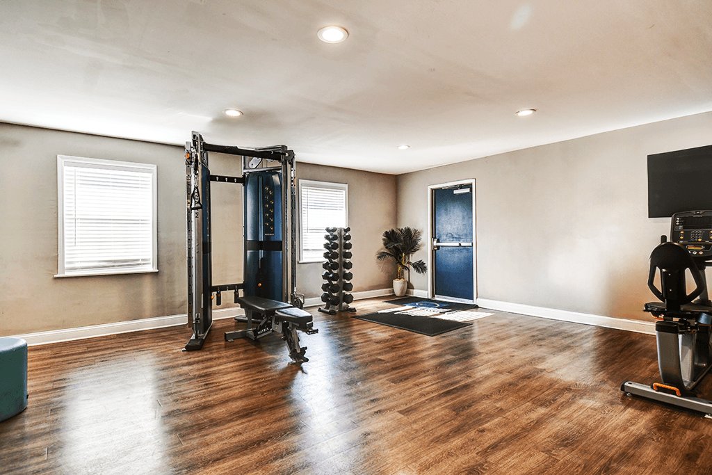 Fitness center at Ashton Brook Apartments, featuring strength equipment.