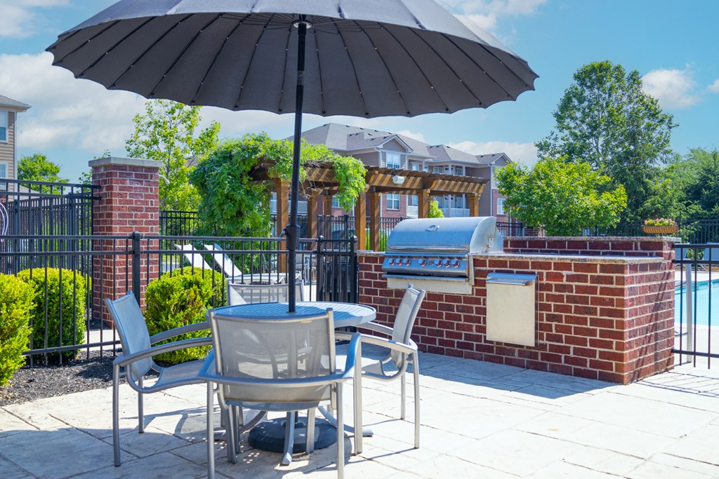 Grilling Station with Shaded Umbrella Seating at Westhaven Luxury Apartments