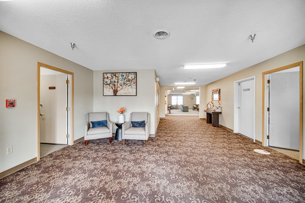 Hallway with seating at Kirby Manor