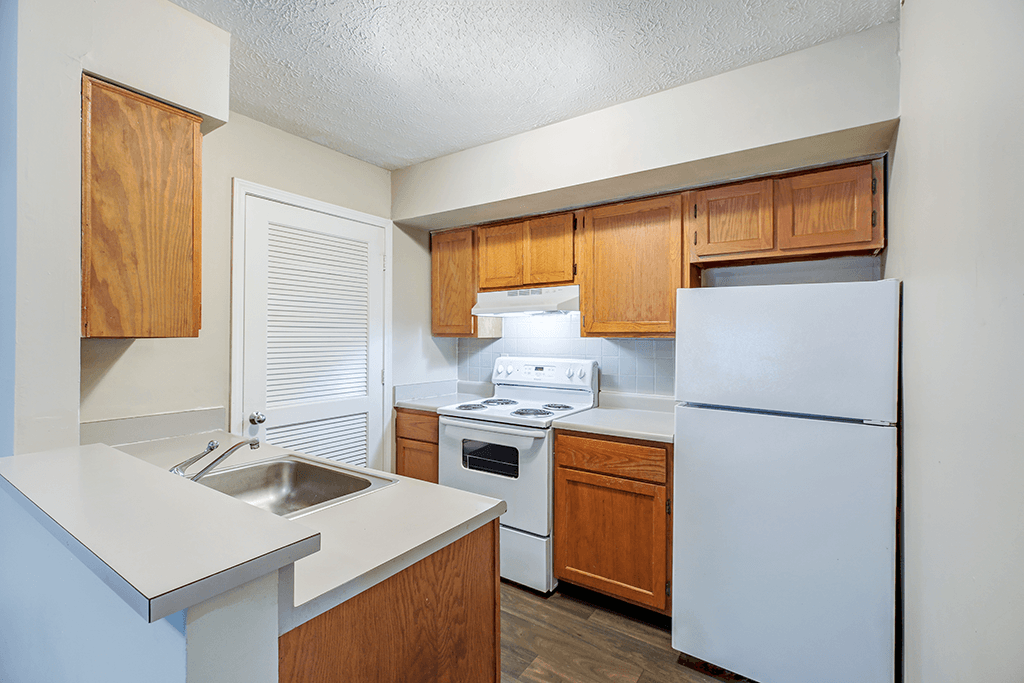 Kitchen in a 2-bedroom, 1-bathroom apartment at Hampton Place Apartments, featuring appliances, counter space, and cabinets.