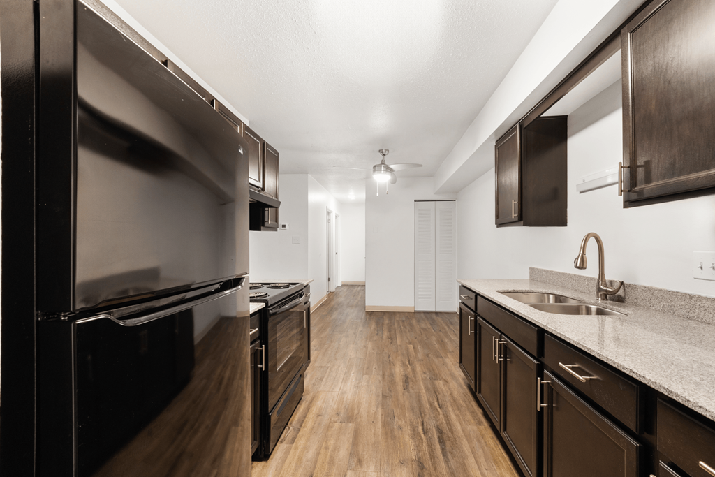 Kitchen in a 2-bedroom, 1-bathroom apartment at Country View Apartments, featuring modern kitchen appliances, ample counter space, and cabinets.