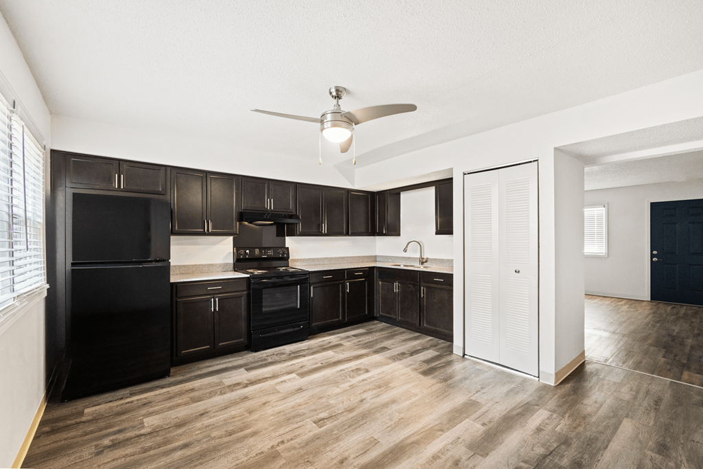 Kitchen in a 2-bedroom, 1-bathroom townhome at Country View Apartments, featuring appliances, spacious countertops, and cabinets.
