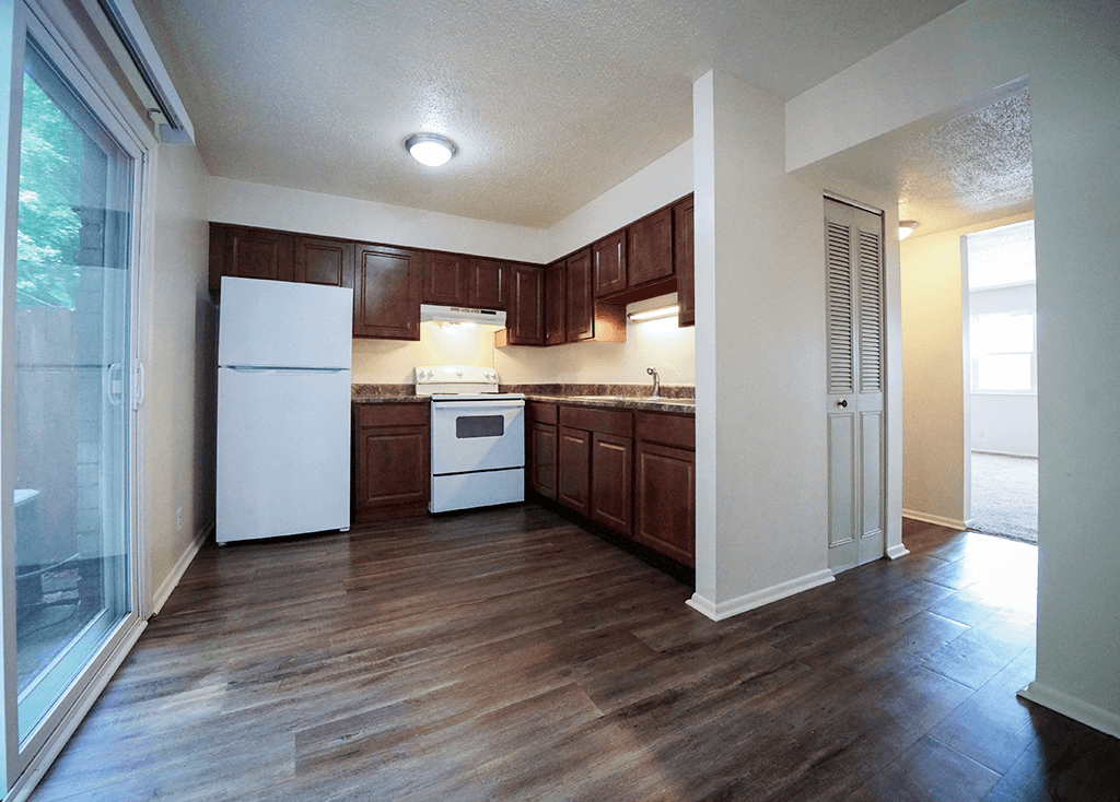 Kitchen in a 2-bedroom townhome at Rainbow Hills Apartments with kitchen appliances and cabinets.