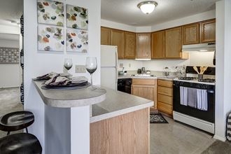 Kitchen and Breakfast Bar at Ashmore Trace Apartments