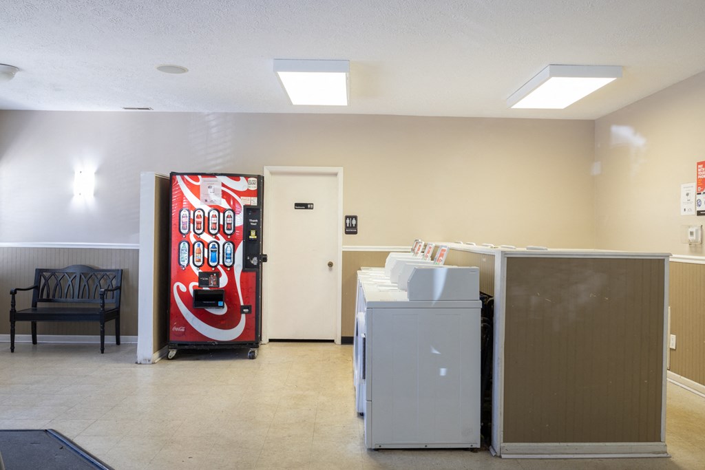 Laundry Center with a vending machine and restroom access at Briarwood Apartments in Columbus, IN