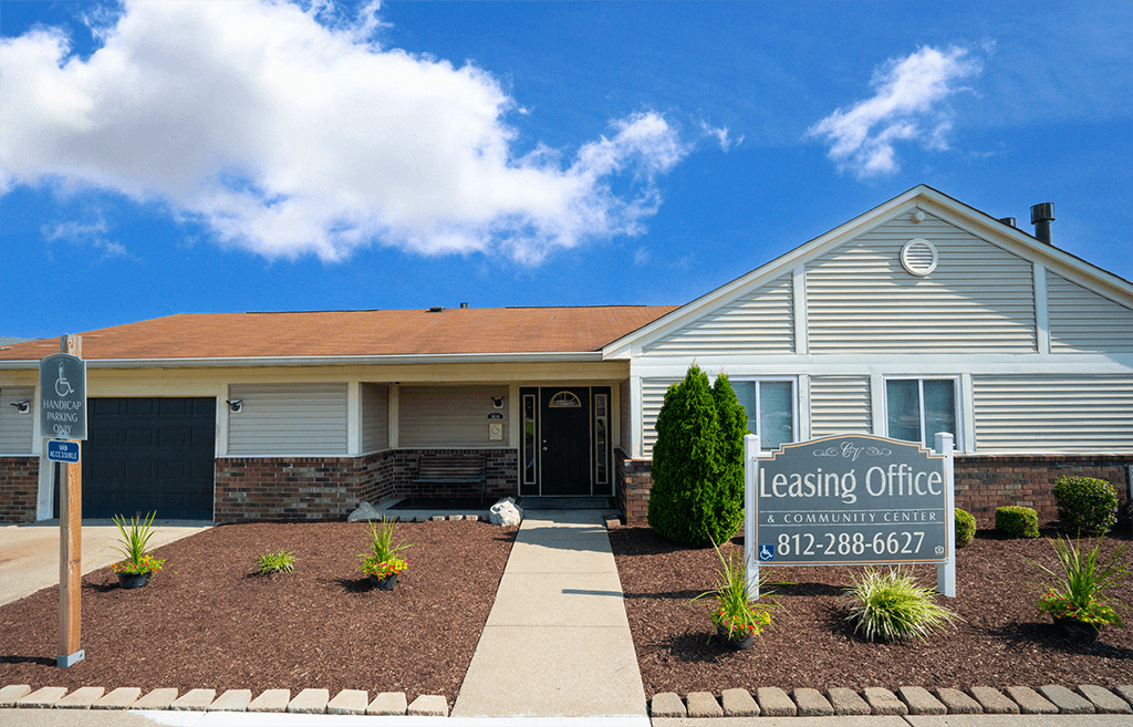 Leasing office at Colonial Village Apartments, featuring a welcoming entrance and well-kept landscaping.