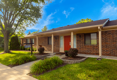 Exterior view of Henderson Court Apartments showcasing architecture and well-maintained surroundings.