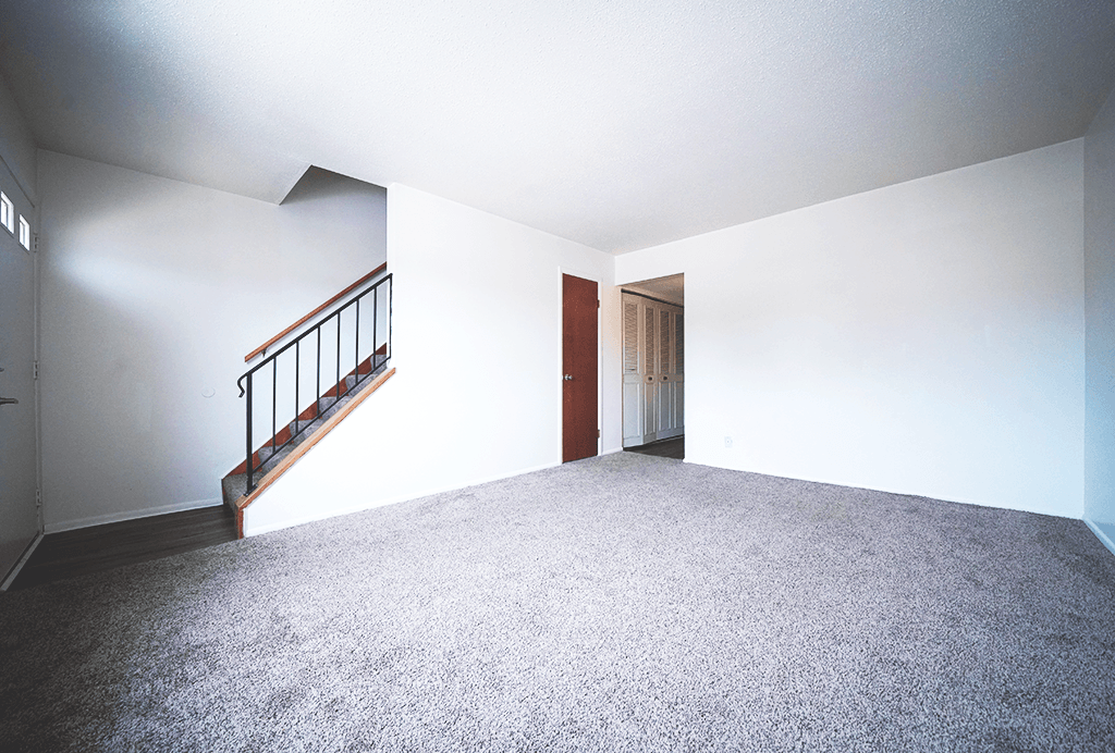 Living room in a 2-bedroom townhome at Rainbow Hills Apartments with spacious layout and natural light.