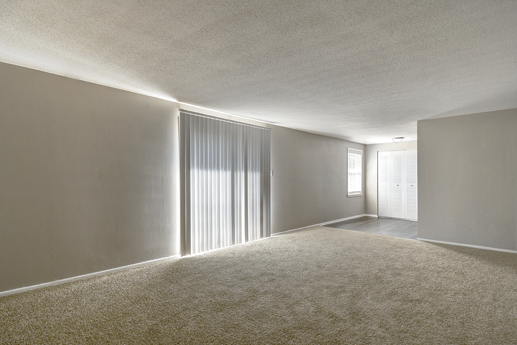 Living and dining room in a 2-bed, 1-bath apartment at Ashton Brook, featuring an open layout.