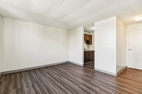 Living room and kitchen in a one-bedroom apartment at Fowler in Lafayette, IN.