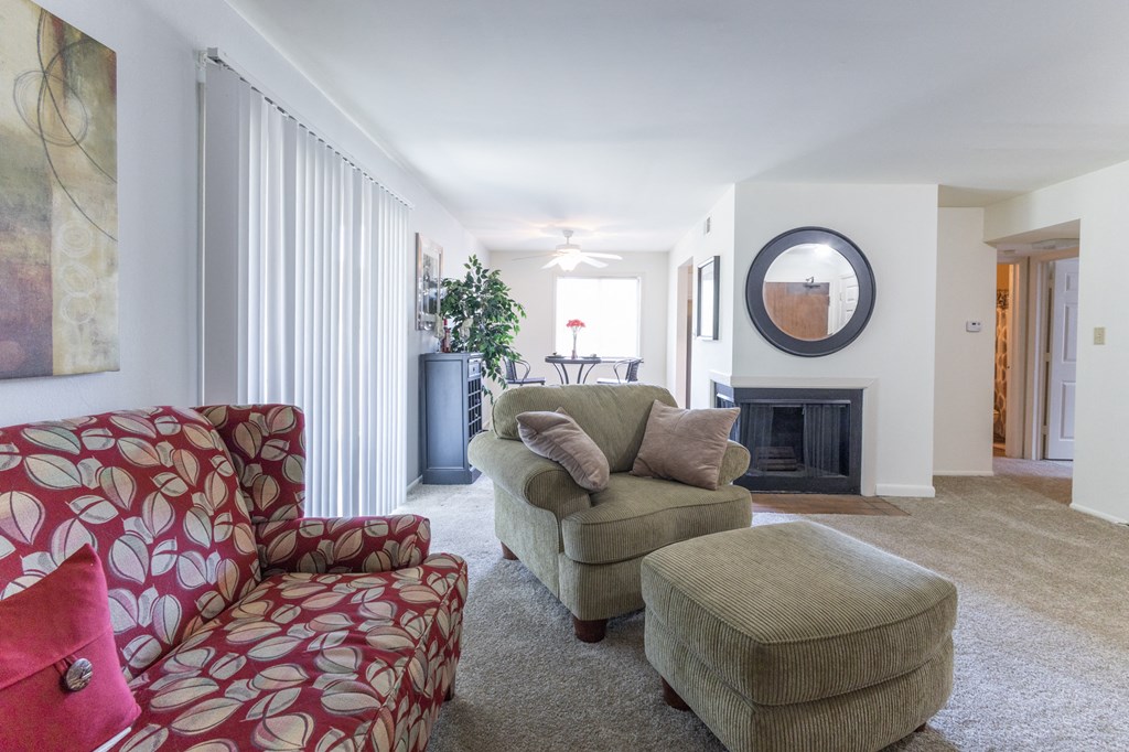 Living and dining room with patio access in the 1 bedroom apartment  at Woodbridge Apartments